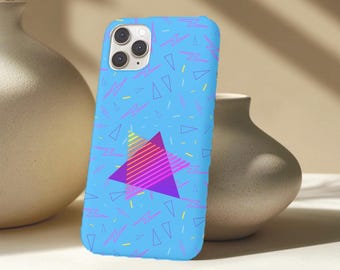 May include: A light blue phone case with a retro 80s design. The case features a pattern of pink lightning bolts, yellow dashes, and blue triangles. A large, colourful triangle with a gradient of pink, yellow, and purple is centered on the case.