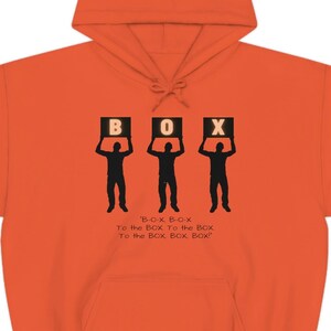 May include: Orange hooded sweatshirt with a graphic of three figures holding up boxes that spell out "BOX". The text "BOX BOX To the BOX To the BOX To the BOX, BOX, BOX!" is printed below the figures.