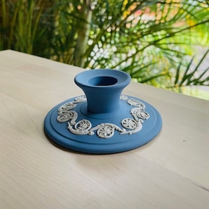 Wedgwood Jasperware blue candlestick holder with pattern motifs