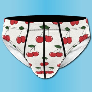 May include: White underwear with a black waistband and a repeating pattern of red cherries.