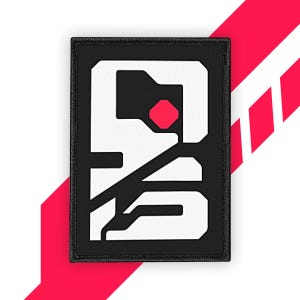 以下が含まれることがあります： 白の幾何学模様と中央に赤い正方形がある長方形の黒いパッチ。パッチは、赤い斜めストライプのある白い背景にあります。