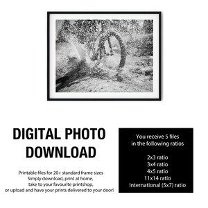 May include: A black and white digital photograph print featuring a mountain bike wheel splashing through water, framed in a thin black border. Text below reads: DIGITAL PHOTO DOWNLOAD. You receive 5 files in the following ratios: 2x3, 3x4, 4x5, 11x14, and International 5x7.