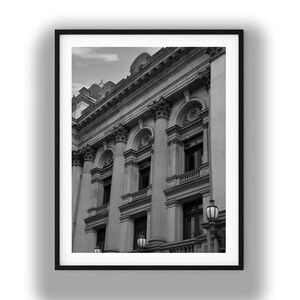 May include: Black and white framed print of a classical building facade. The image features large columns, arched windows, and ornate architectural details. The photograph is in grayscale, emphasizing the building's structure and design.