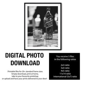 May include: A black and white digital print featuring a bottle of Johnnie Walker Black Label whisky next to a glass filled with ice. The text reads DIGITAL PHOTO DOWNLOAD, followed by a list of five available file ratios: 2x3, 3x4, 4x5, 11x14, and International 5x7.