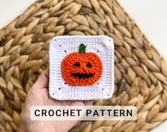 May include: White crochet square with an orange pumpkin face in the center. The pumpkin has a green stem and a black face with a smile. "CROCHET PATTERN" is written in black text below the square.