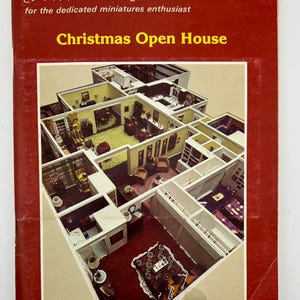 May include: A miniature dollhouse with multiple rooms, including a kitchen, living room, and bedroom. The dollhouse is decorated for Christmas with a red carpet and festive decorations. The cover of the magazine "Nutshell News" is titled "Christmas Open House".