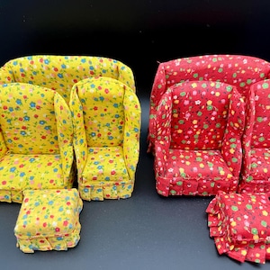 May include: Miniature furniture set featuring two armchairs and a sofa in yellow floral fabric, with a matching ottoman. A second set includes two armchairs, a sofa, and an ottoman in red floral fabric. Perfect for dollhouses.