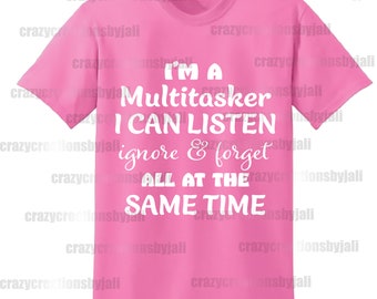 May include: Pink t-shirt with white text that reads "I'm a Multitasker I can listen ignore & forget all at the same time".