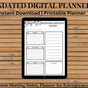 May include: A digital planner displayed on a tablet, featuring a business meeting notes template. The planner includes sections for purpose, workshop, and project notes, with the text "UNDATED DIGITAL PLANNER" and "Instant Download | Printable Planner". The background is a wooden surface.