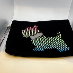 May include: Black velvet clutch with a rainbow-colored rhinestone dog design.