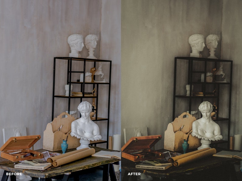 May include: A wooden table with a brown leather box, two rolled up pieces of parchment paper, and a blue vase. There are two white plaster busts on a black metal shelf in the background.