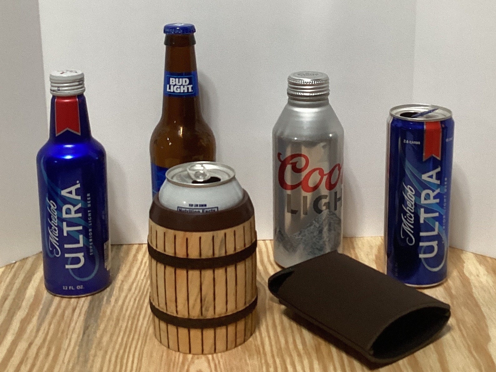 Box Elder Koozie With Capabilities to Hold 12oz Can or Bottle. Brown