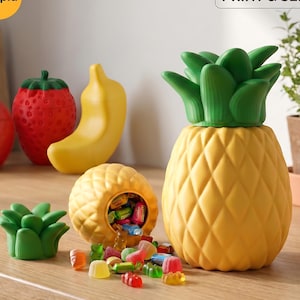 May include: A collection of colorful, fruit-shaped containers and a green succulent-shaped container. A yellow pineapple-shaped container is filled with colorful gummy candies. The image includes the text "COMMERCIAL LICENSE: PRINT & SELL."