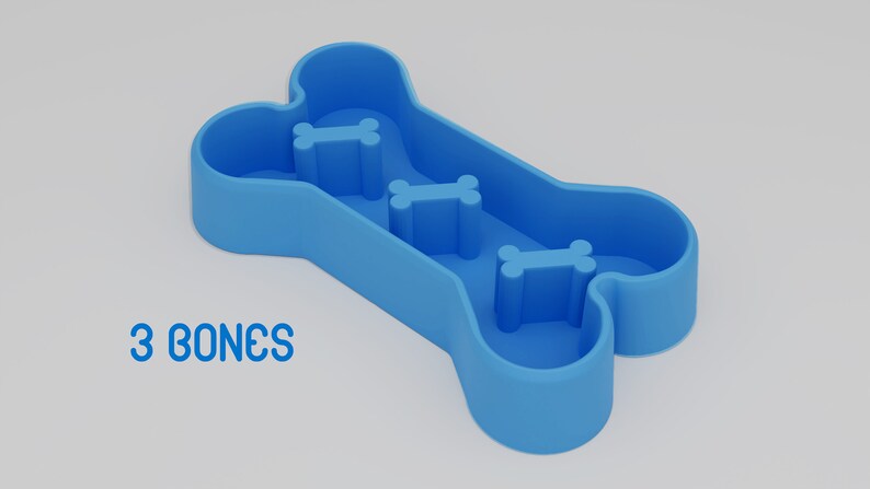 May include: Blue plastic dog bowl shaped like a bone with three smaller bone-shaped indentations. "3 BONES" is printed below the bowl.