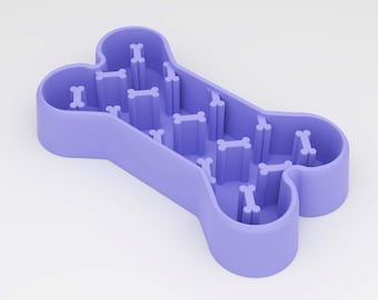 May include: Purple bone-shaped slow feeder dog bowl with a maze of small bone-shaped indentations.