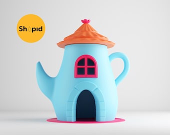 May include: A blue teapot shaped like a house with an orange roof, a pink door, and a pink window. The teapot is sitting on a pink base.