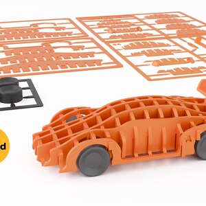 May include: An orange wooden model car kit with gray wheels and a rear spoiler. The kit includes several orange sheets with car parts and a black base with four wheels. The logo "Shopid" is visible.