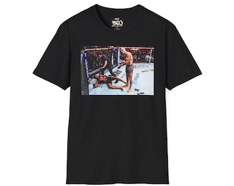 May include: Black t-shirt with a graphic print of a mixed martial arts fight. The graphic shows two fighters in a ring, one on the ground and the other standing over him. The text "UFC 200" is printed on the shirt.
