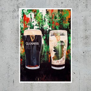May include: A print featuring two Guinness pint glasses. One glass is filled with dark stout, the other with a light-colored beer, with the outline of Ireland. The background has green, red, and white brushstrokes, with the Guinness logo on each glass.