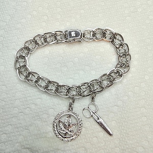 Sterlingzilveren geweven schakelbedelarmband met twee bedels
