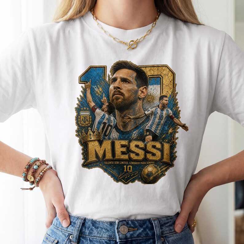 May include: A white t-shirt featuring a graphic print of Lionel Messi. The design includes a large portrait of the player, two action shots, the number 10, a gold crown, a soccer ball, and the text MESSI, TALENTO SEM LIMITES, LENDARIO PARA SEMPRE.