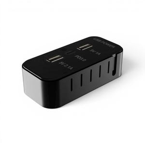 May include: A black USB power adapter with multiple ports. The top surface has two USB ports labeled "5V 2.1A" and "5V 1A", and a USB-C port labeled "PD3.0". The text "USB POWER" is also visible.