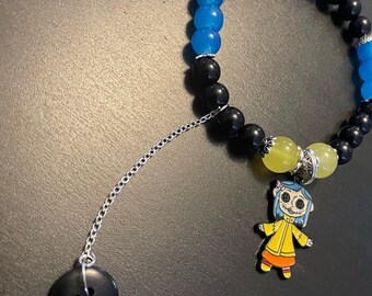 Bracelet fait main sur le thème de Coraline avec breloque pendante chaîne boutonnée noire