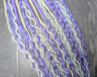 synthetic curly dreadlock ponytail hair extensions on a bobble
