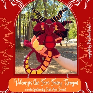 May include: Volcaryis the Fire Fairy Dragon, a crochet pattern by Pink Mew Crochet, features a red, orange, and yellow crocheted dragon with black and yellow horns. The dragon is being held by a hand in front of a blurred background of trees.