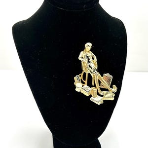 AJC Shopping Lady with Gifts Gold Tone Brooch