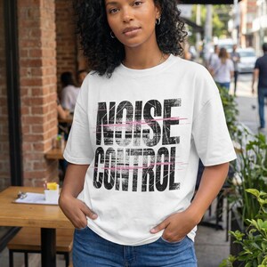 Bold “Unfiltered” statement t-shirt design with distressed black block letters and pink slash accents for women streetwear