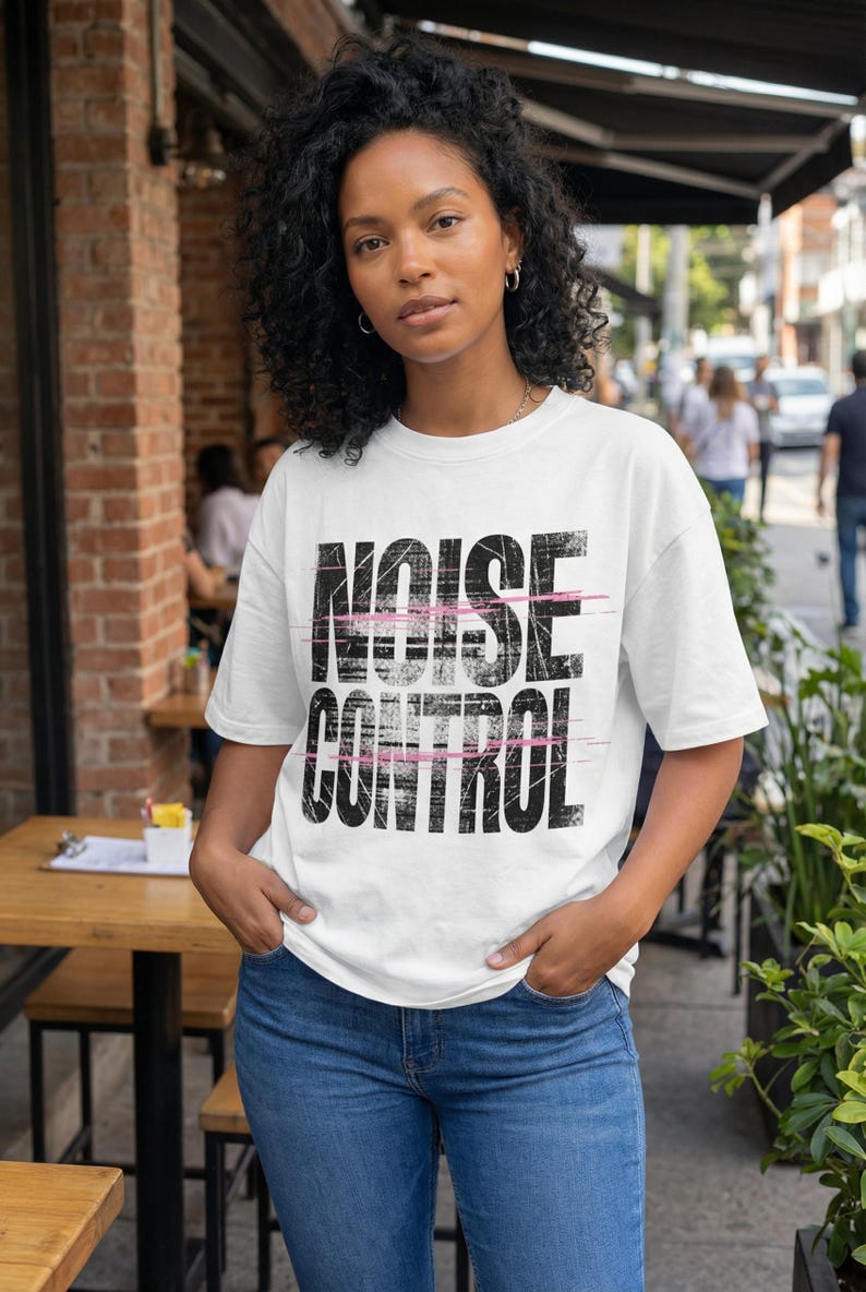 Bold “Unfiltered” statement t-shirt design with distressed black block letters and pink slash accents for women streetwear