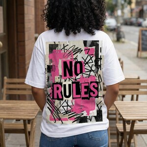 Back view women streetwear tee with oversized “No rules” graffiti typography repeated in black and pink on white shirt