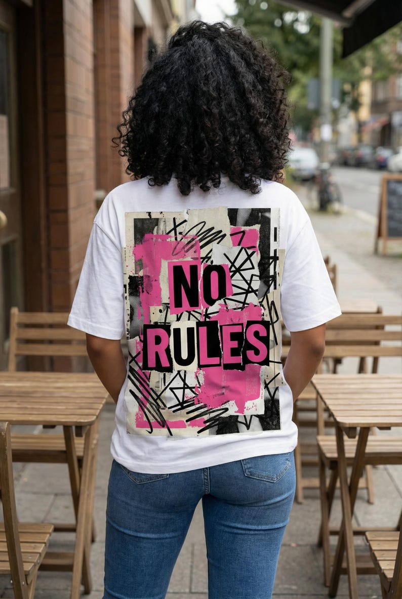 Back view women streetwear tee with oversized “No rules” graffiti typography repeated in black and pink on white shirt