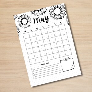 May include: A printable calendar for the month of May with a sunflower design. The calendar has spaces for each day of the week, a section for monthly goals, and a note section.
