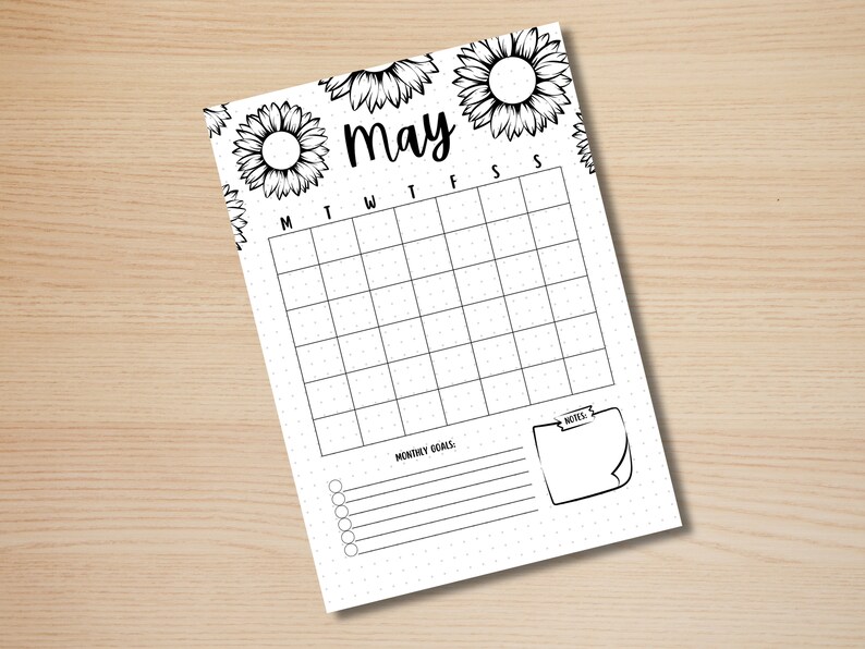 May include: A printable calendar for the month of May with a sunflower design. The calendar has spaces for each day of the week, a section for monthly goals, and a note section.