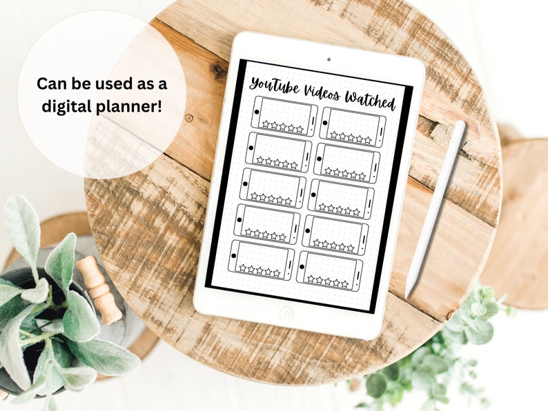May include: A digital planner template on a tablet screen with a black and white design. The template is for tracking YouTube videos watched and includes a space for rating each video with five stars.