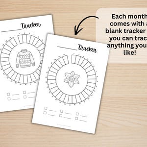 May include: Two white paper sheets featuring circular habit trackers labeled Tracker with numbers one through thirty-one. One sheet displays a sweater illustration in the center, while the other shows a flower. Text reads: Each month comes with a blank tracker so you can track anything you&rsquo;d like!