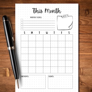 May include: A printable monthly calendar planner with a dotted grid, space for monthly goals, notes, birthdays, and events. The calendar has a simple black and white design.