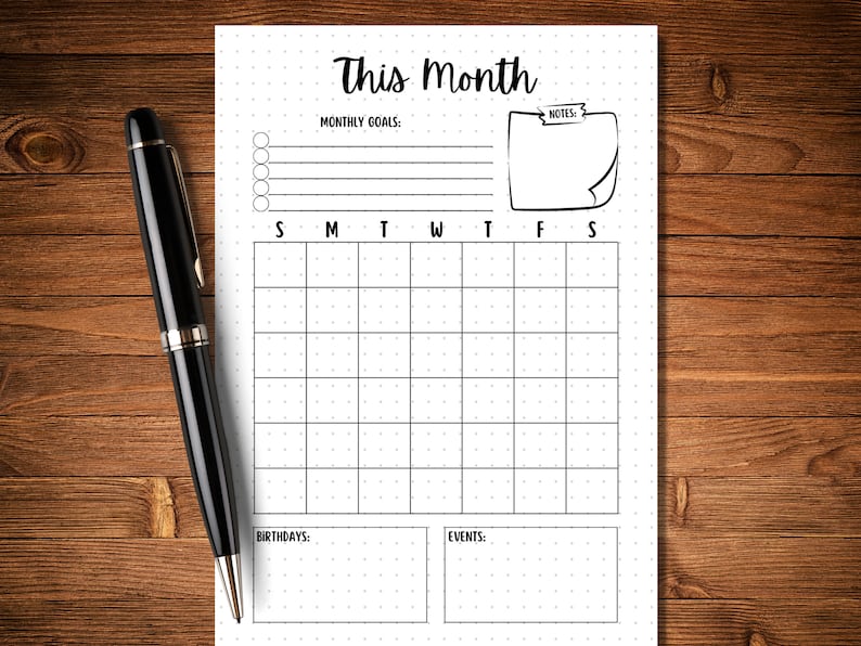 May include: A printable monthly calendar planner with a dotted grid, space for monthly goals, notes, birthdays, and events. The calendar has a simple black and white design.