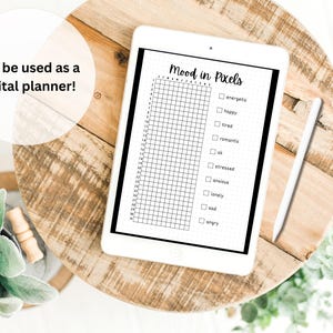 May include: A digital planner template on a tablet screen with the title "Mood in Pixels". The template features a grid of squares for tracking mood and a list of emotions including energetic, happy, tired, romantic, stressed, anxious, lonely, sad, and angry.