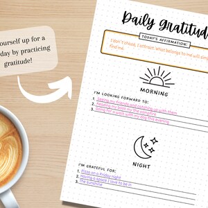 May include: A printable daily gratitude journal with a dotted background. The journal has sections for morning and night. The morning section has a sun icon and the text "I'm looking forward to:". The night section has a moon icon and the text "I'm grateful for:".