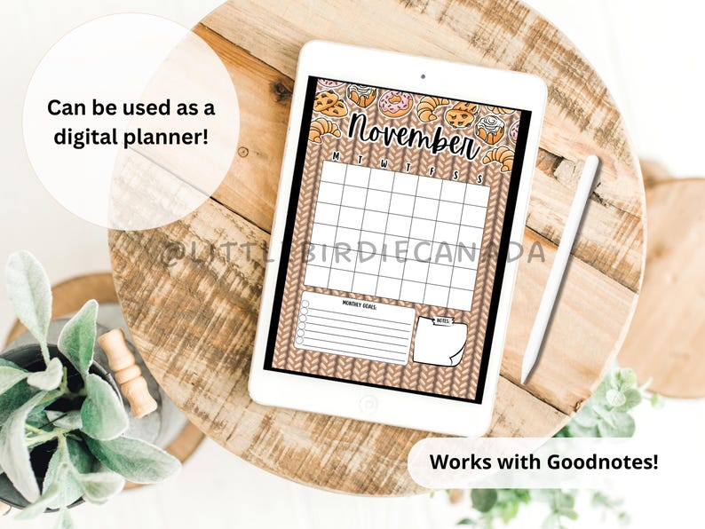 May include: A digital planner displayed on a tablet, featuring a November calendar with a cozy, knitted background and pastry illustrations. The tablet is accompanied by a stylus and the text "Can be used as a digital planner!" and "Works with Goodnotes!"