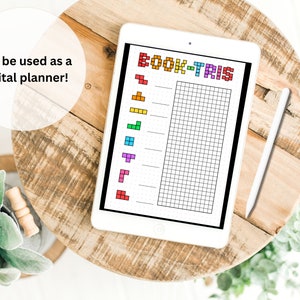 May include: A digital planner on a tablet with a grid and the text "BOOK-TRIS" in rainbow colors. The planner can be used to track books read.