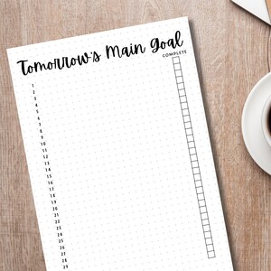 May include: A white printable planner page with the text "Tomorrow's Main Goal" and a checklist with 29 numbered items. The checklist is labelled "Complete".