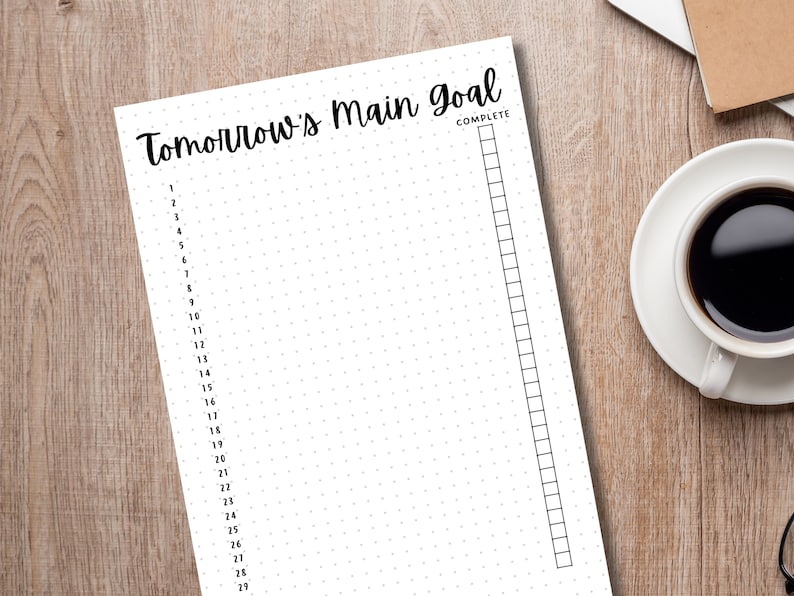 May include: A white printable planner page with the text "Tomorrow's Main Goal" and a checklist with 29 numbered items. The checklist is labelled "Complete".