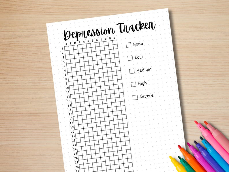 K&ouml;nnte beinhalten: Ein druckbarer Depressions-Tracker mit einem Raster f&uuml;r jeden Tag des Monats und einer Schweregrad-Skala von keiner bis schwer.