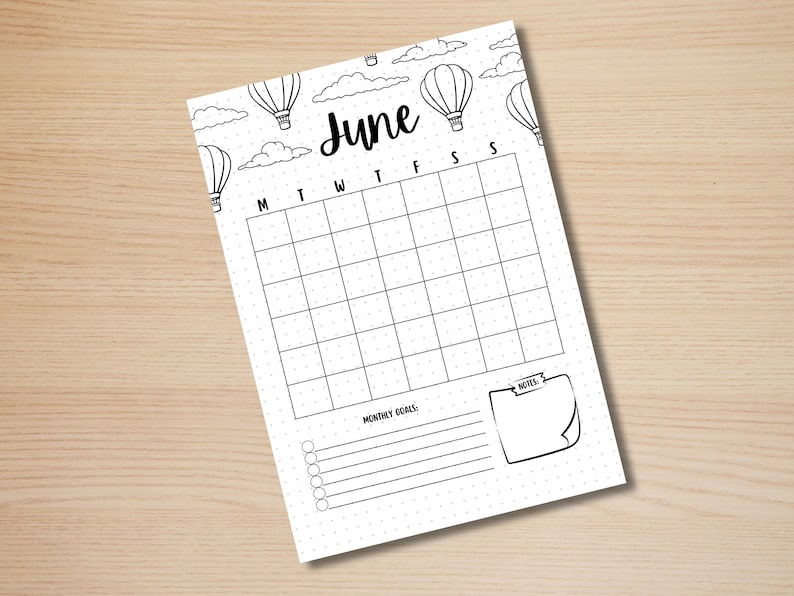 May include: Printable June calendar with a hot air balloon theme. The calendar has a grid for each day of the month with space for notes and monthly goals.