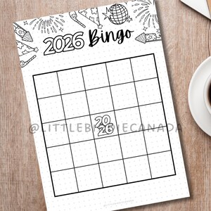May include: A black and white 2026 Bingo game sheet with a grid of squares. The top of the sheet has festive illustrations of fireworks and party hats. The word "Bingo" is written in a script font.