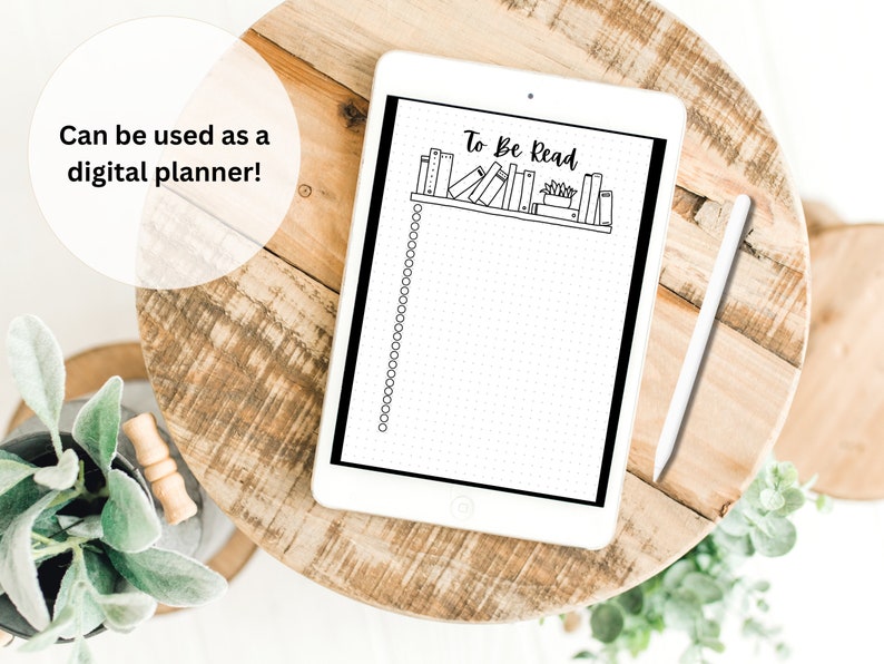 May include: A digital planner with a bookshelf design and the text "To Be Read" at the top. The planner is on a tablet with a white stylus next to it.